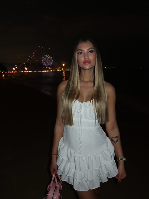 Festive Beach Night: White Ruffle Mini Dress Outfit and Styling Ideas