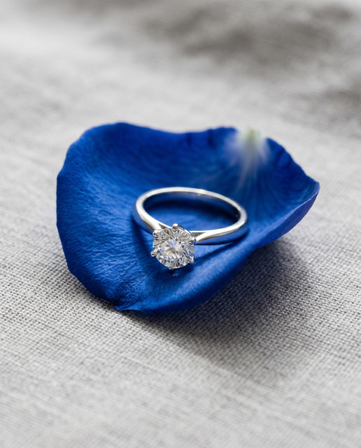 Elegant Solitaire Ring Styling Reference Photo Set with Blue Flower Petal Accent