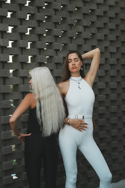 Monochromatic Resort Editorial Photo Set: Chic Sleeveless Jumpsuit & Trouser Styling